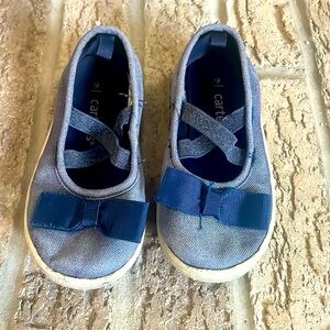 Carter’s blue slip on shoes with a bow
